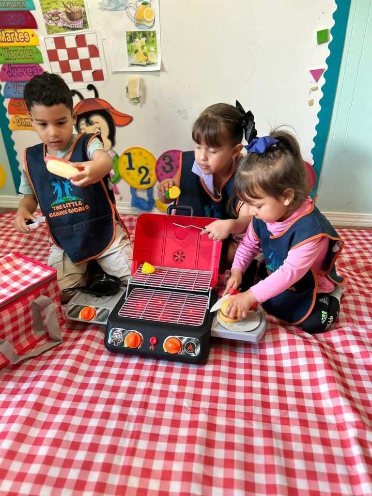 Bellevue preschool children playing with toy kitchen