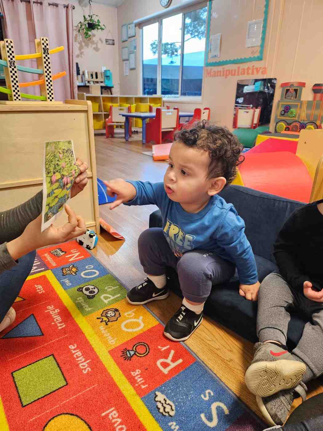 Kids doing activity with teacher at Federal Way childcare center | preschool program