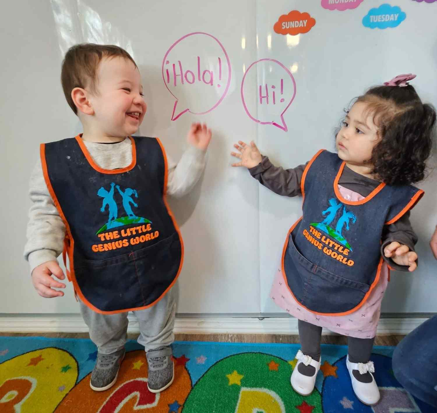 Two toddlers greeting each other at Tukwila daycare classroom | early childhood education