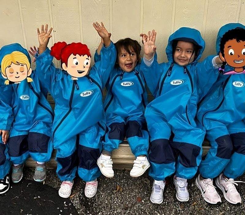 Tukwila daycare children smiling in uniforms